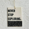 Never stop exploring -  porcelain tag